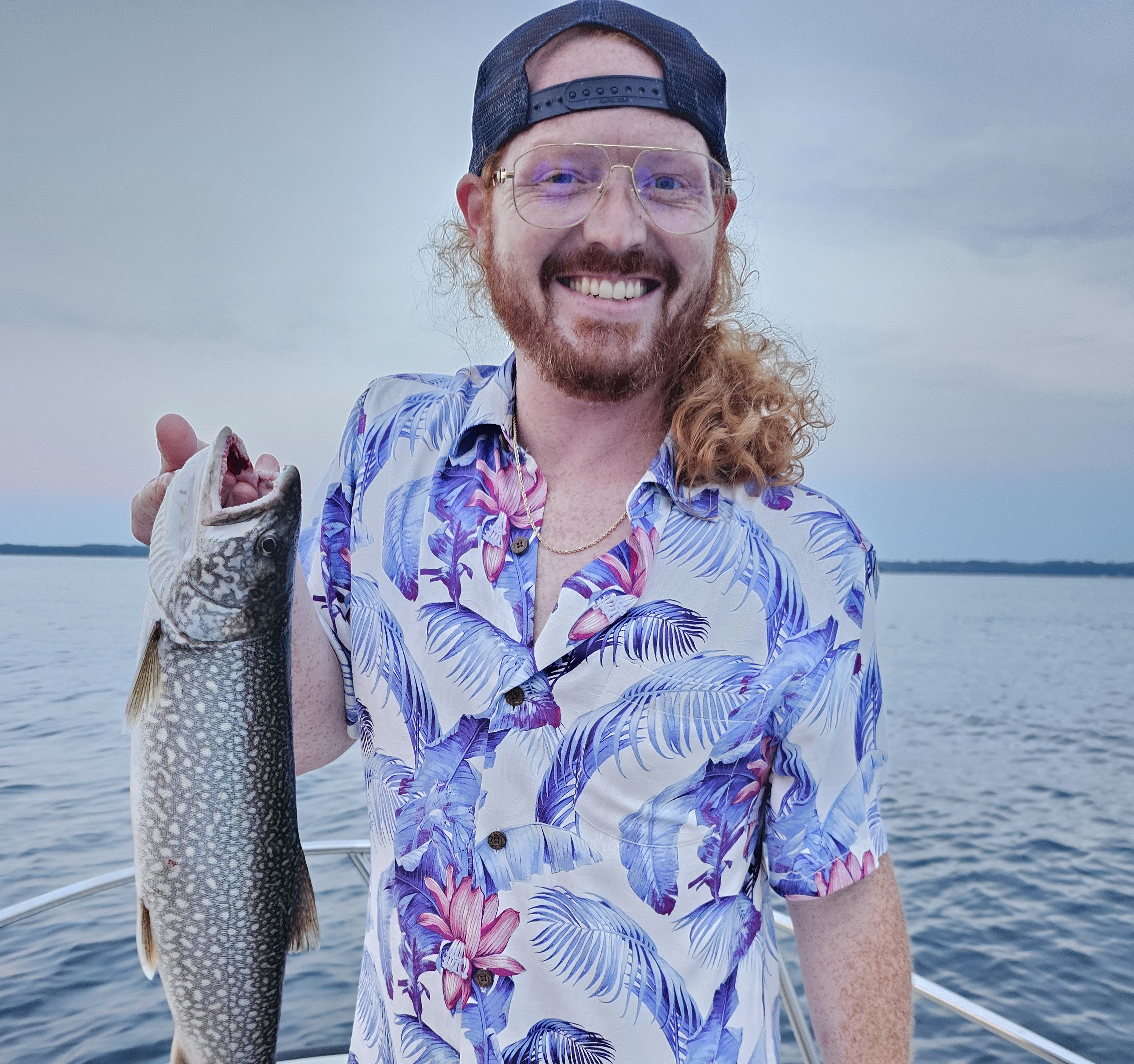 Trajan Centers holding a fish he caught